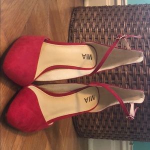 Red suede pumps